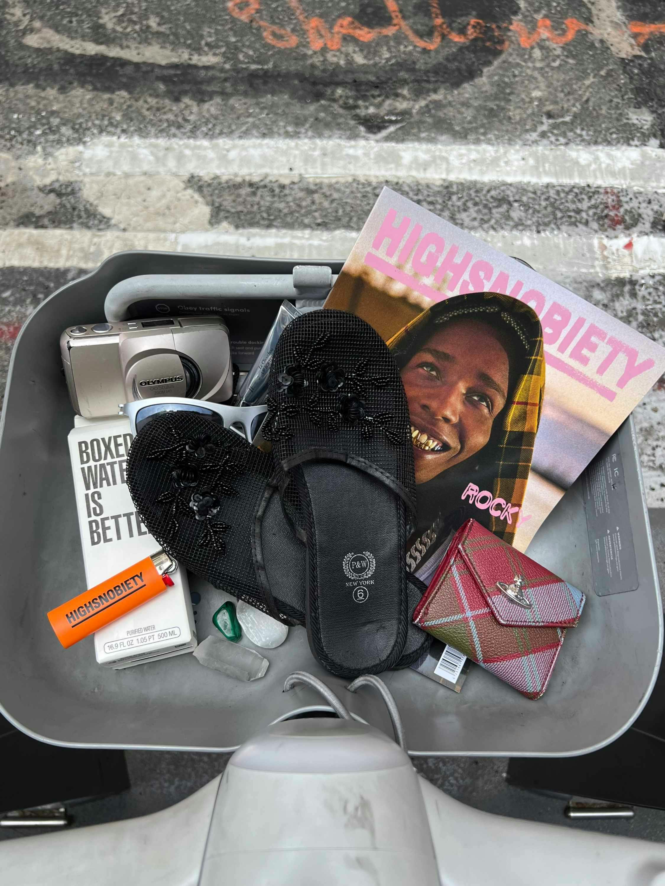 Citibike baskets accessorized with magazines, shoes, sunglasses